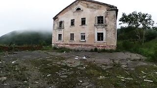 Exhibitionist girl walks through abandoned buildings in POV