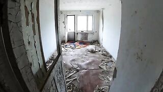 Exhibitionist girl walks through abandoned buildings in POV