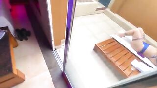 A sexy redhead has sex in a bikini with an employee in a public place