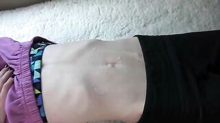 Hot belly button fetish action in a video