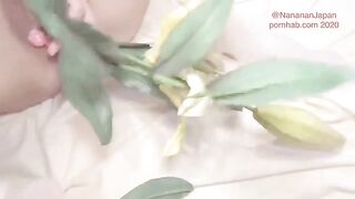 Bukkake with flowers in the ass of a Japanese girl in a neat dress