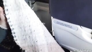 A flight attendant's big boobs are visible through her transparent jacket during a flight