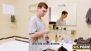A girl is brushing her teeth when a man enters the bathroom