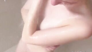 We shower, massage each other, and have sex over the couch in this intimate homemade scene