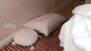 A girl is sharing a bed with her friend, who is very sexy