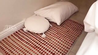 A girl is sharing a bed with her friend, who is very sexy