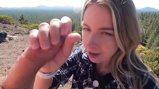 Blonde girl makes a blowjob on the top of the mountain