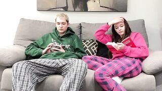 Pervert stepbrother watches porn and masturbates next to his stepsister on the couch