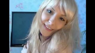 Blonde beauty plays with her pussy using her fingers in a sensual act