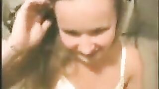 A young girl is having fun with her boyfriend at home