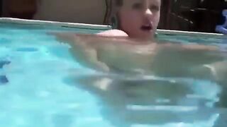 Babe with a dildo in her ass under the water