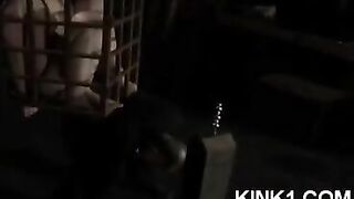 A slave in a cage is at the mercy of his master's whims