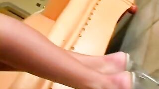 A beauty in leather pants masturbates on a leather chair, showcasing her solo skills