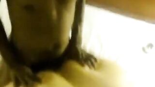 A fat woman lays down on two guys and gets fucked hard