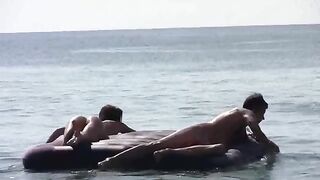 A cute girl went swimming naked on the beach, it was hot