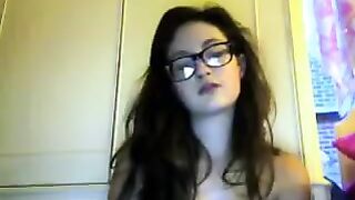 Student with glasses takes off her clothes during a video call