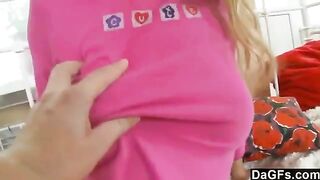 A sweet little girl plays with her toys and gets excited on the bed