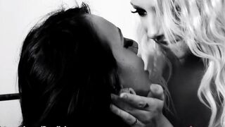 Two girls having fun with dildo on the bed