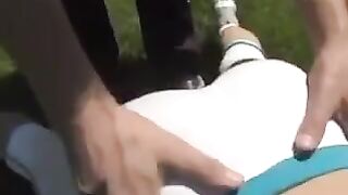 A beautiful busty brunette woman receives a cumshot on her tits