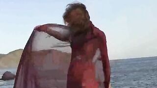 A sexy girl has small wet boobs while walking outside naked