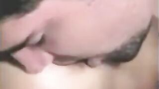 The man fucked with a strapon, while another fingered his dick