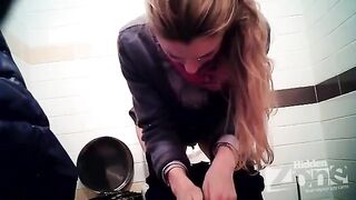 A girl pees in the toilet and there is a camera hidden
