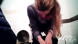 A girl pees in the toilet and there is a camera hidden