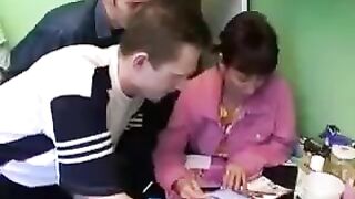 A Russian woman with her son has sex with three guys