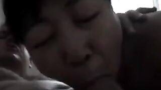 The Chinese woman practices blowjob with her tongue