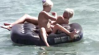 A naked girl is having fun on the mattress, embodying wild freedom
