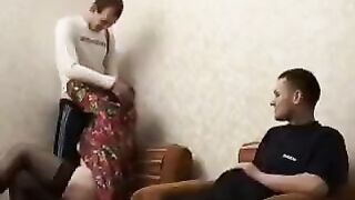 A mature woman seduces her son and his friend in this hot video