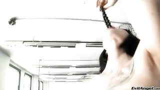 A brunette woman puts the balls in her vagina and finishes