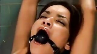 A bald guy raped a girl using a sex machine in hardcore BDSM
