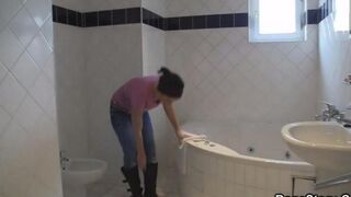 A hot brunette with natural tits has a wild shower sex