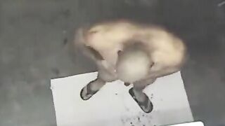 A man washed naked in the shower, not knowing he was being filmed