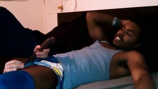 A black woman fucked by a white man on the bed in hardcore style