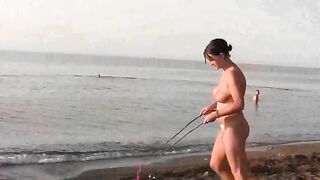 A couple has fun on the beach without any clothes on