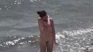 A couple of free-spirited nudists enjoying beach life