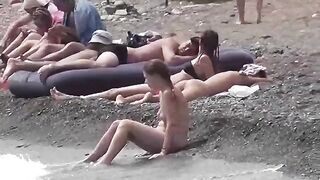 A couple of free-spirited nudists enjoying beach life