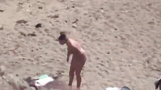 A couple of naked people in the middle of the sea, it's beautiful