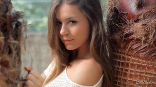 A nice young Russian takes off all her clothes and shows her ass