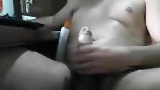 The guy masturbates sitting at the computer