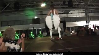 A young girl is learning to striptease on the pole