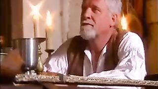 A girl in medieval clothes is fucking with a guy who loves big tits