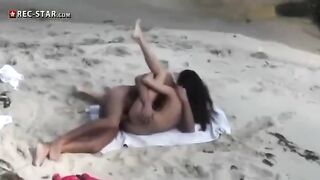 A couple has sex on the beach without any obstacles