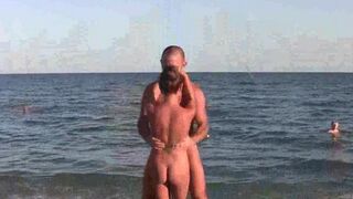 Nudist girl practices acrobatics on the bare beach