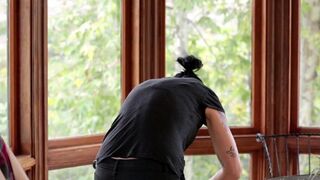 A Vietnamese girl with a strap-on fucked her friend in the kitchen