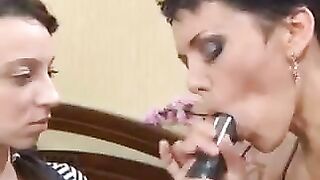 A mother is giving a lesson to her Russian daughter on how to perform a blowjob using a strapon