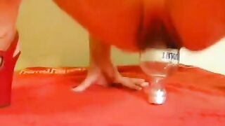 Fisting with a bottle and a large dildo is not for the faint-hearted