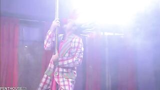 The girl is waiting for a partner to part her legs and begin the show